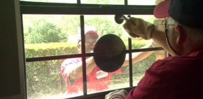 Removing fogged insulated glass on a window for replacement.