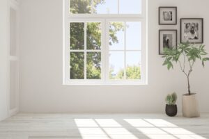 White empty room with summer landscape in window.
