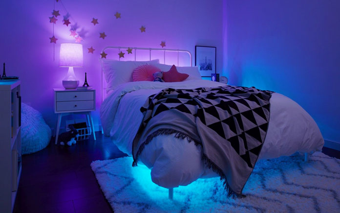 Girls' bedroom with purple and blue Cync light bulbs setting a relaxing mood