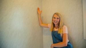 “Today’s Homeowner” co-host Chelsea Lipford Wolf, seen admiring her bathroom wall panels from Wetwall
