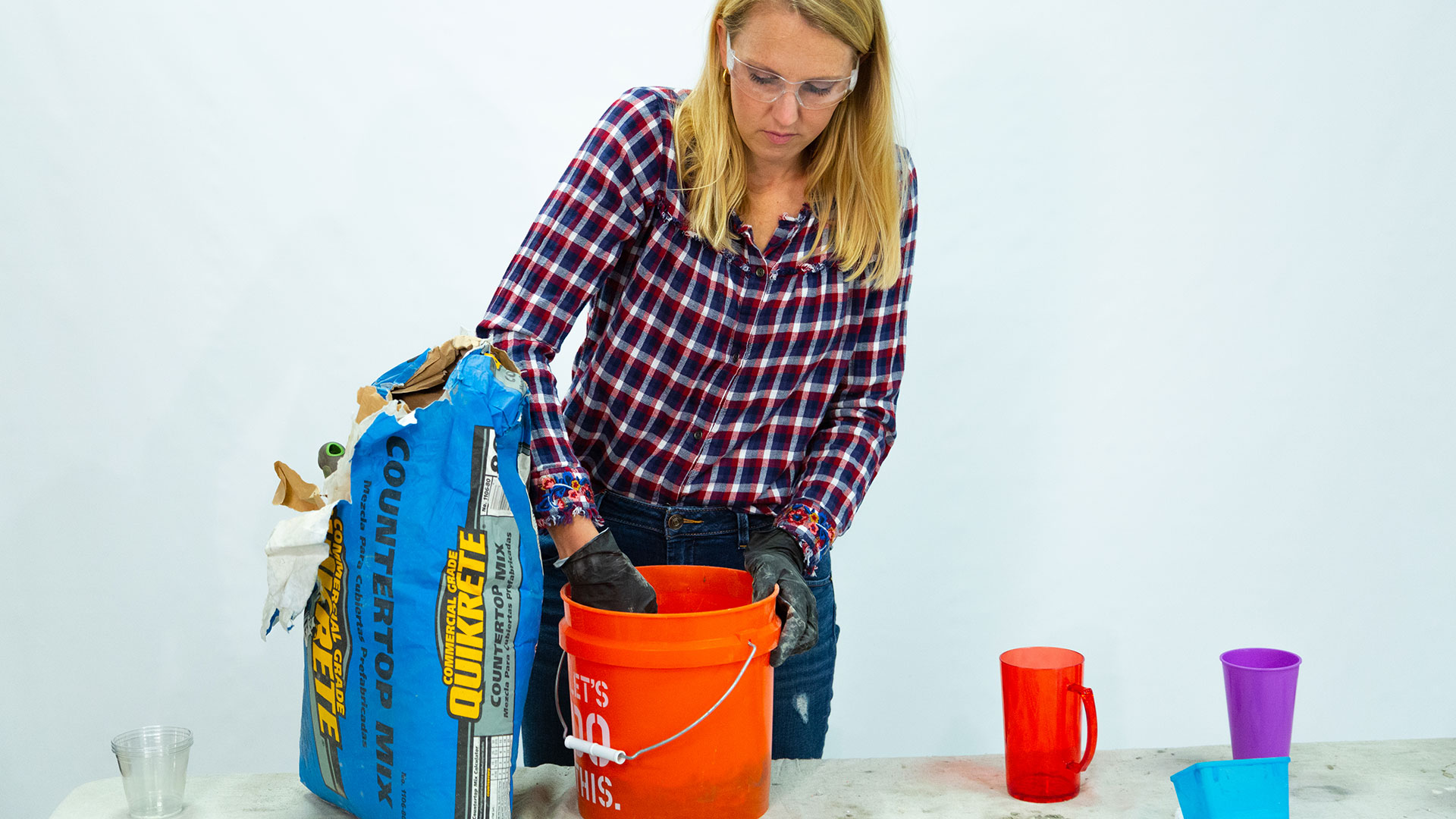 “Today’s Homeowner” host Chelsea Lipford Wolf mixes concrete on a table