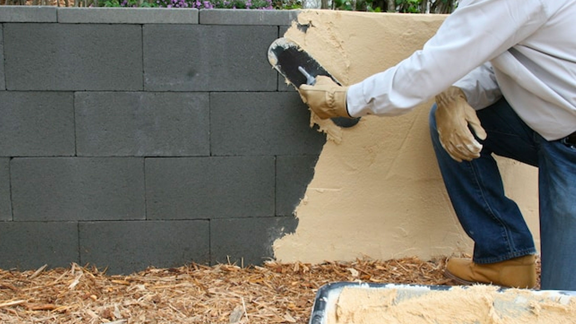 Applying a stucco finish to a concrete block wall