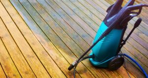 pressure washer on a wooden deck